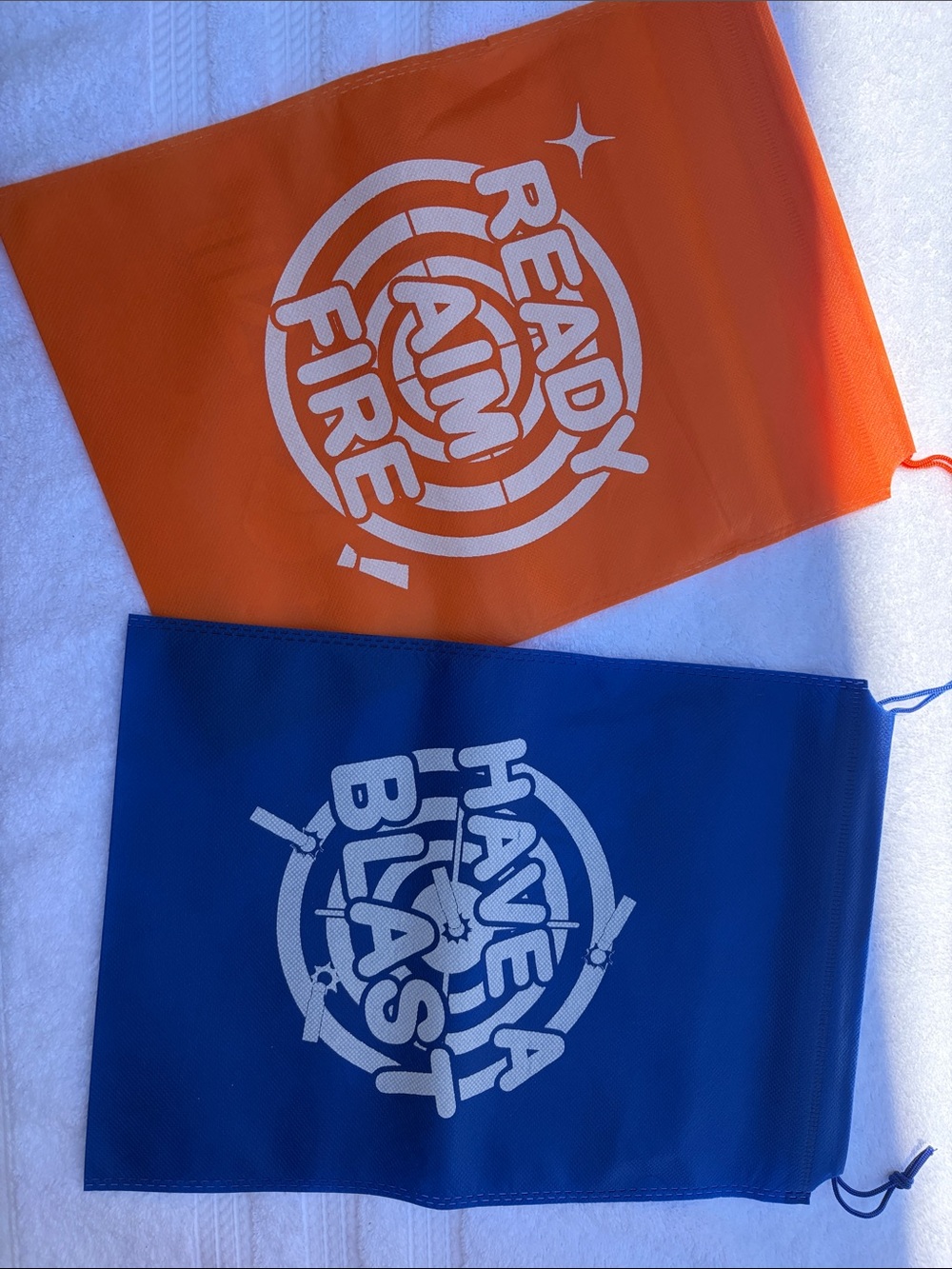 Ready Aim Fire & Have a Blast Drawstring Bags - Orange & Blue